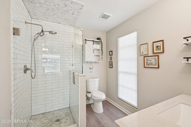884 Live Oak Ln, Fleming Island, FL 32003 - bathroom featuring a stall shower, wood finished floors, and vanity