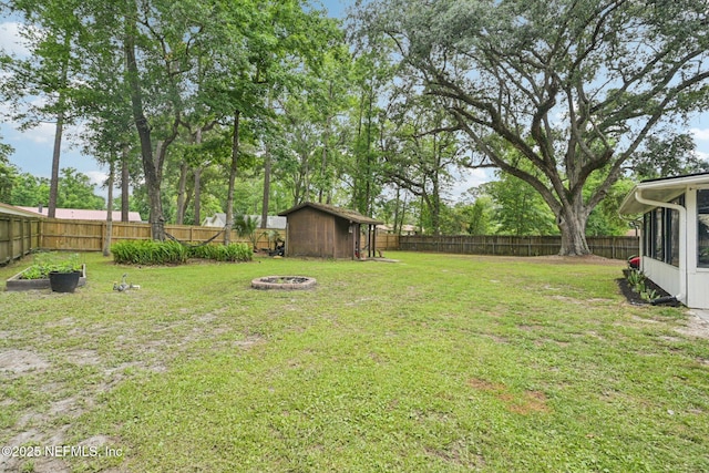 884 Live Oak Ln, Fleming Island, FL 32003 - fenced backyard with a fire pit and a shed