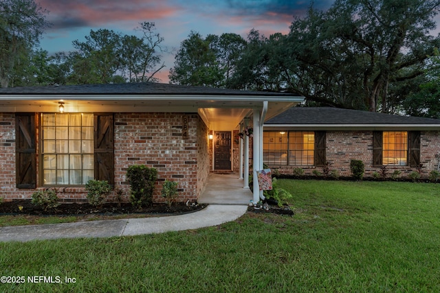 884 Live Oak Ln, Fleming Island, FL 32003 - ranch-style home with brick siding and a yard