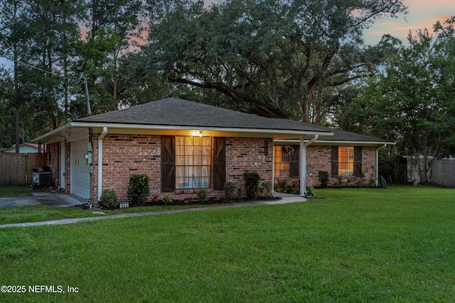 884 Live Oak Ln, Fleming Island, FL 32003 - single story home featuring asphalt driveway, an attached garage, and brick siding