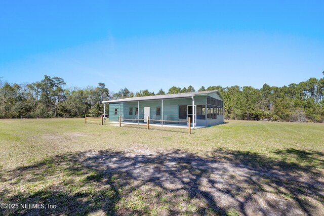 1895 Deer Run Rd, Saint Augustine, FL 32084 - rear view of property featuring a sunroom and a yard