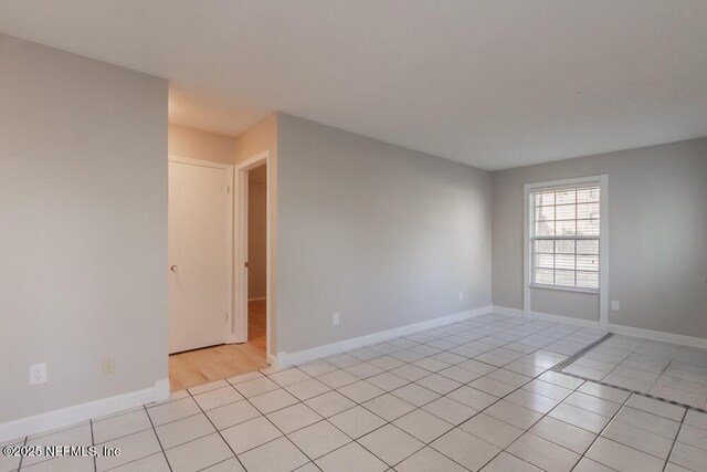 1050 Assisi Ln, Jacksonville, FL 32233 - unfurnished room with light tile patterned floors and baseboards