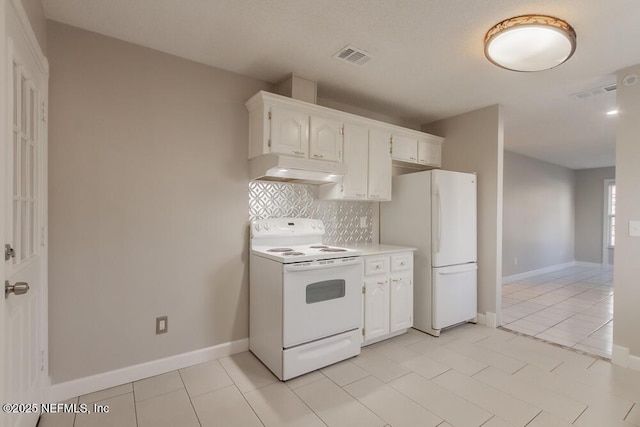 1050 Assisi Ln, Jacksonville, FL 32233 - kitchen with white appliances, under cabinet range hood, backsplash, light countertops, and white cabinetry