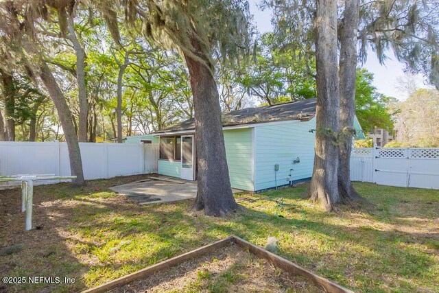 1050 Assisi Ln, Jacksonville, FL 32233 - view of yard featuring a patio area