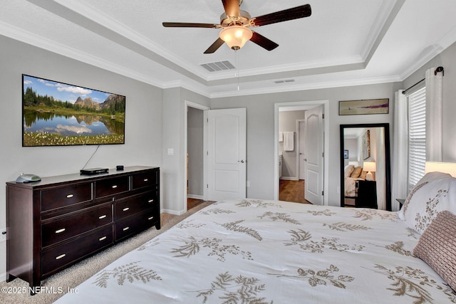 328 Falcon Quest Ln, Saint Augustine, FL 32095 - bedroom with a tray ceiling, ornamental molding, a ceiling fan, connected bathroom, and baseboards