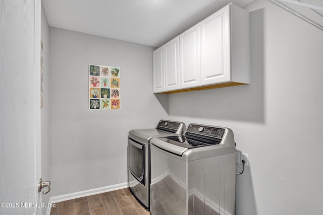 328 Falcon Quest Ln, Saint Augustine, FL 32095 - washroom with cabinet space, washing machine and dryer, wood finished floors, and baseboards