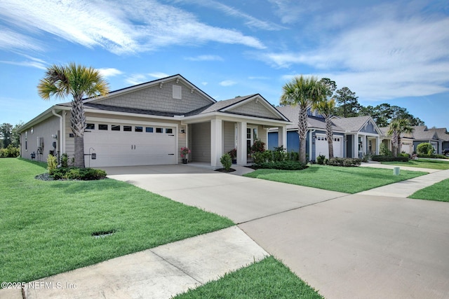 328 Falcon Quest Ln, Saint Augustine, FL 32095 - view of front of house featuring an attached garage, a front yard, and driveway