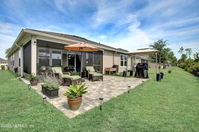 328 Falcon Quest Ln, Saint Augustine, FL 32095 - rear view of property with outdoor lounge area, a patio, stucco siding, a lawn, and a gazebo
