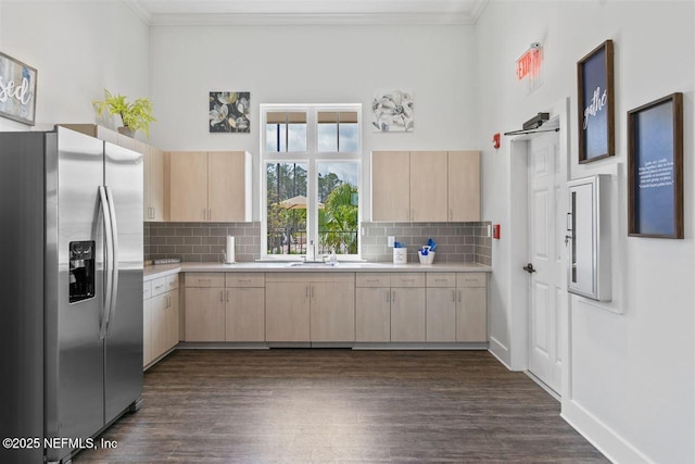 328 Falcon Quest Ln, Saint Augustine, FL 32095 - kitchen featuring stainless steel refrigerator with ice dispenser, light brown cabinetry, light countertops, ornamental molding, and dark wood-style flooring