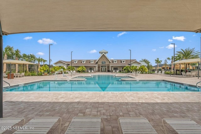 328 Falcon Quest Ln, Saint Augustine, FL 32095 - community pool featuring a patio area