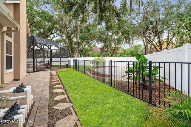 3746 Cardinal Oaks Cir, Orange Park, FL 32065 - fenced backyard with a patio area and a lanai