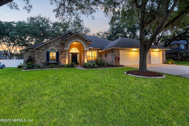 3746 Cardinal Oaks Cir, Orange Park, FL 32065 - view of front of property featuring stone siding, driveway, an attached garage, and stucco siding