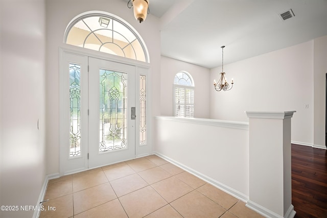 337 Bell Branch Ln, Saint Johns, FL 32259 - tiled foyer with a chandelier and baseboards