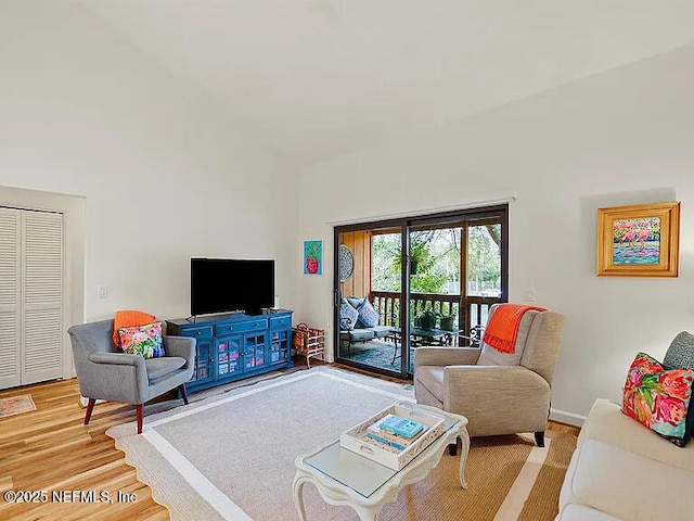 2700 Mizell Ave Unit 402B, Fernandina Beach, FL 32034 - living area with high vaulted ceiling and light wood-type flooring