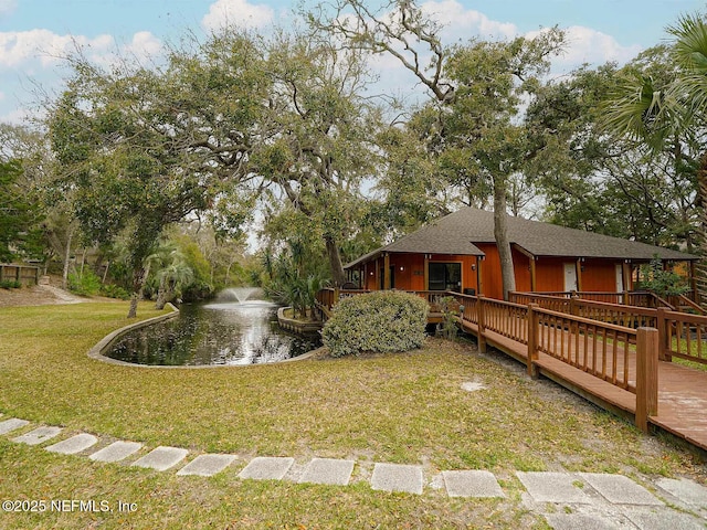 2700 Mizell Ave Unit 402B, Fernandina Beach, FL 32034 - view of grassy yard with a deck with water view