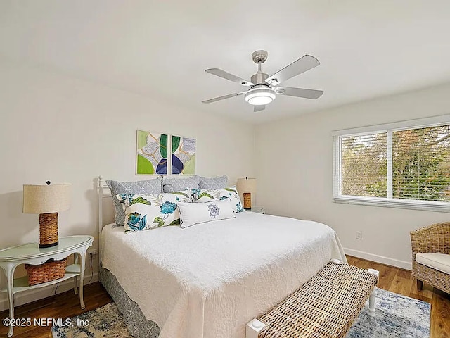 2700 Mizell Ave Unit 402B, Fernandina Beach, FL 32034 - bedroom featuring wood finished floors, baseboards, and ceiling fan