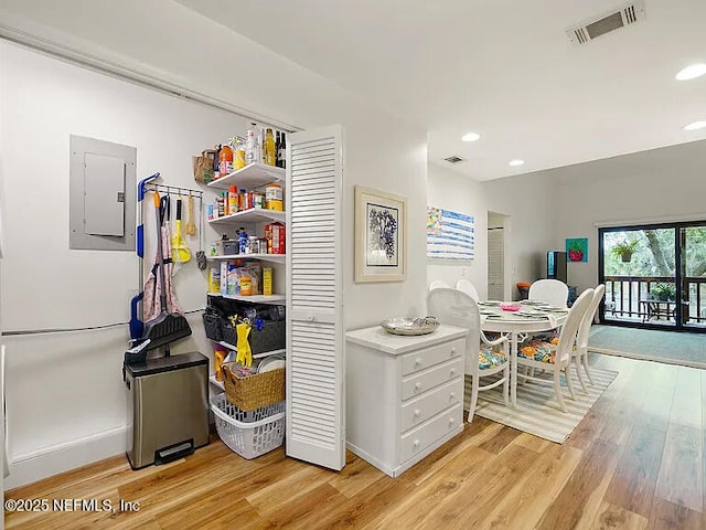 2700 Mizell Ave Unit 402B, Fernandina Beach, FL 32034 - dining room with electric panel, light wood finished floors, recessed lighting, and baseboards
