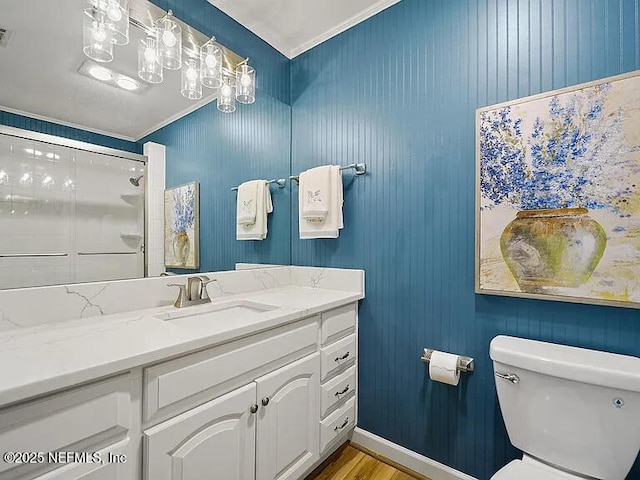 2700 Mizell Ave Unit 402B, Fernandina Beach, FL 32034 - bathroom featuring toilet, vanity, wood finished floors, and a shower