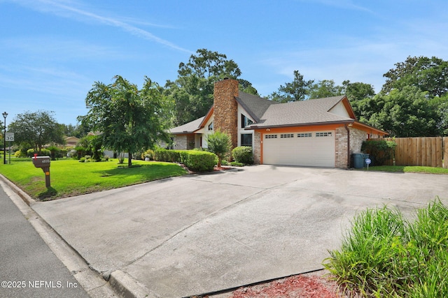 5604 Swamp Fox Rd, Jacksonville, FL 32210 - view of front facade with a garage, driveway, a chimney, brick siding, and a shingled roof