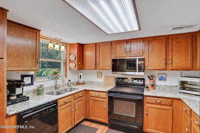 5604 Swamp Fox Rd, Jacksonville, FL 32210 - kitchen featuring black appliances, a sink, a textured ceiling, light stone counters, and brown cabinetry