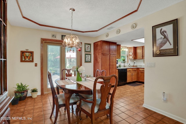5604 Swamp Fox Rd, Jacksonville, FL 32210 - dining room with a textured ceiling, a chandelier, light tile patterned floors, a raised ceiling, and baseboards