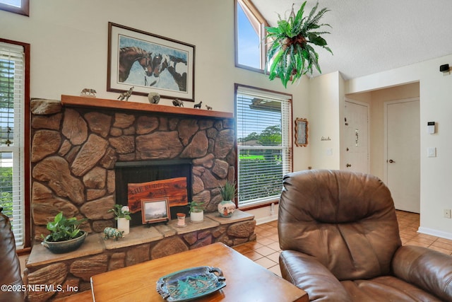 5604 Swamp Fox Rd, Jacksonville, FL 32210 - living room with tile patterned flooring, baseboards, a textured ceiling, and a fireplace