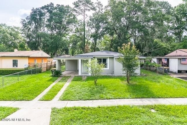 1831 Lake Shore Blvd, Jacksonville, FL 32210 - ranch-style house with driveway and an attached carport