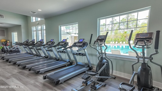 2719 Oak Stream Dr, Green Cove Springs, FL 32043 - exercise room with baseboards, wood finished floors, and recessed lighting
