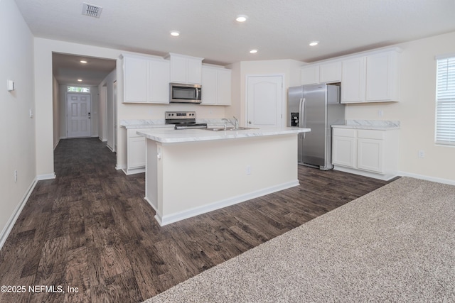 2719 Oak Stream Dr, Green Cove Springs, FL 32043 - kitchen with stainless steel appliances, a sink, dark wood finished floors, white cabinetry, and recessed lighting