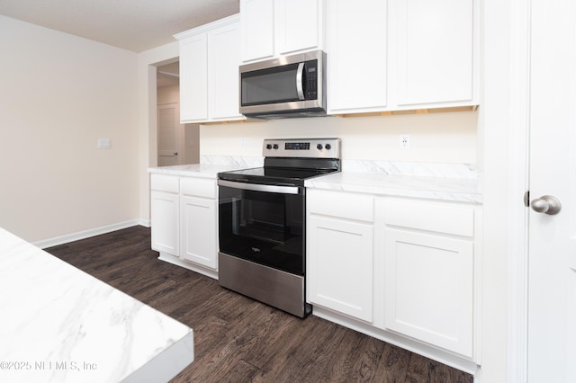 2719 Oak Stream Dr, Green Cove Springs, FL 32043 - kitchen featuring stainless steel appliances, dark wood-style flooring, white cabinetry, baseboards, and light stone countertops