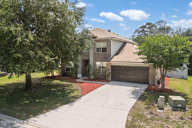 521 Cedar Arbor Ct, Saint Augustine, FL 32084 - view of front of house featuring a garage, a front yard, concrete driveway, and brick siding