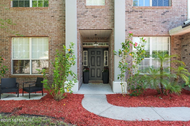 521 Cedar Arbor Ct, Saint Augustine, FL 32084 - view of exterior entry featuring brick siding
