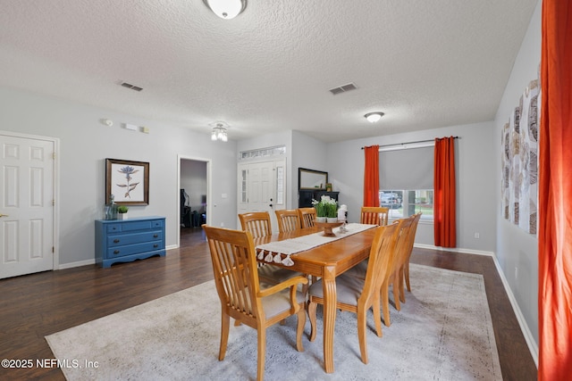 521 Cedar Arbor Ct, Saint Augustine, FL 32084 - dining room with a textured ceiling, baseboards, and wood finished floors