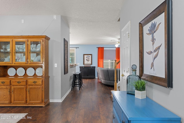 521 Cedar Arbor Ct, Saint Augustine, FL 32084 - hall featuring a textured ceiling, dark wood finished floors, and baseboards
