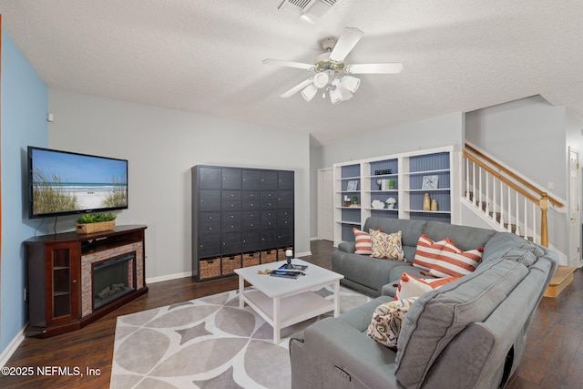521 Cedar Arbor Ct, Saint Augustine, FL 32084 - living room with wood finished floors, a textured ceiling, mail area, baseboards, and a ceiling fan