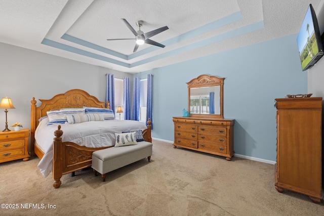 521 Cedar Arbor Ct, Saint Augustine, FL 32084 - carpeted bedroom featuring a raised ceiling, a textured ceiling, baseboards, and a ceiling fan
