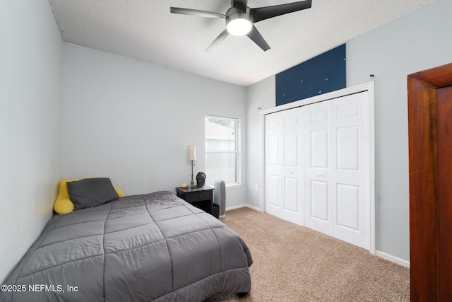 521 Cedar Arbor Ct, Saint Augustine, FL 32084 - bedroom featuring carpet, a closet, ceiling fan, baseboards, and a textured ceiling
