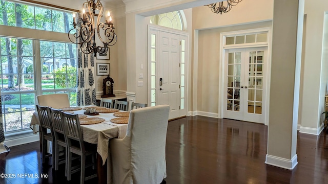 2708 Shade Tree Dr, Fleming Island, FL 32003 - dining space featuring a chandelier, dark wood-style flooring, plenty of natural light, and french doors