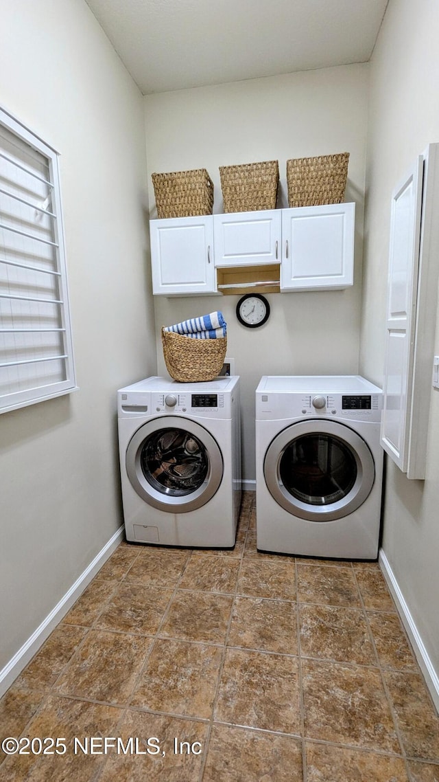 2708 Shade Tree Dr, Fleming Island, FL 32003 - washroom with independent washer and dryer, cabinet space, baseboards, and tile patterned floors