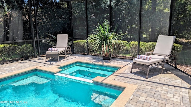 2708 Shade Tree Dr, Fleming Island, FL 32003 - view of pool featuring glass enclosure, a patio, and a pool with connected hot tub