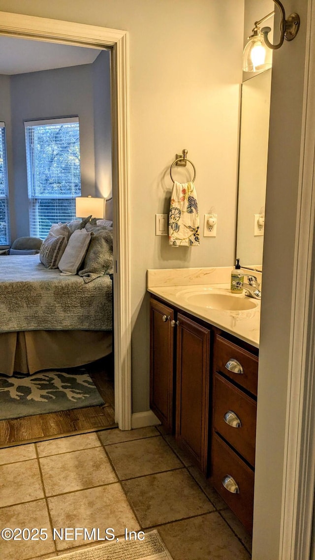 2708 Shade Tree Dr, Fleming Island, FL 32003 - bathroom featuring connected bathroom, vanity, and tile patterned floors
