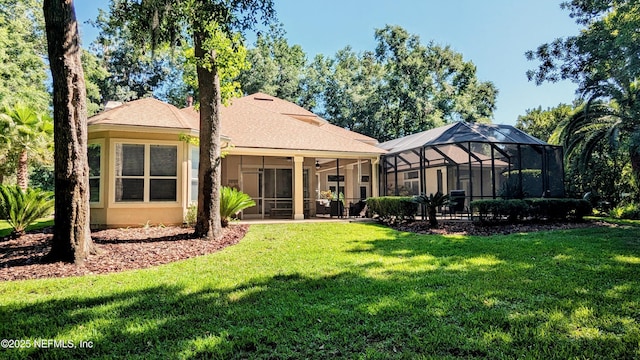 2708 Shade Tree Dr, Fleming Island, FL 32003 - rear view of house with a yard, ceiling fan, stucco siding, a sunroom, and a lanai