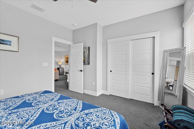 199 Ranch Land Cir, Saint Johns, FL 32259 - carpeted bedroom with a closet, baseboards, and a ceiling fan