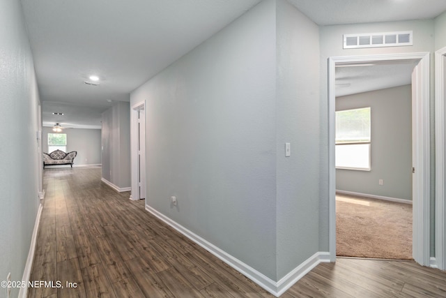 8552 Lake George Cir W, Macclenny, FL 32063 - hallway featuring wood finished floors and baseboards