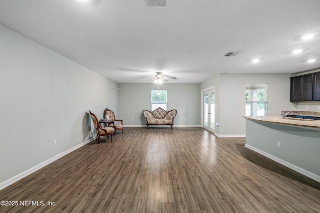 8552 Lake George Cir W, Macclenny, FL 32063 - unfurnished room with a ceiling fan, dark wood finished floors, a sink, baseboards, and a textured ceiling