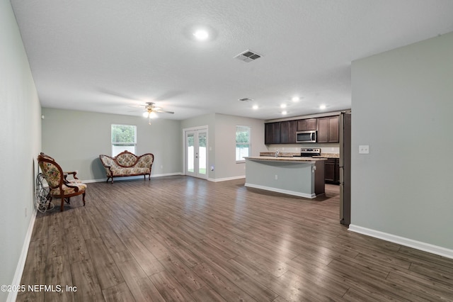 8552 Lake George Cir W, Macclenny, FL 32063 - unfurnished living room featuring ceiling fan, dark wood-style floors, baseboards, recessed lighting, and a sink