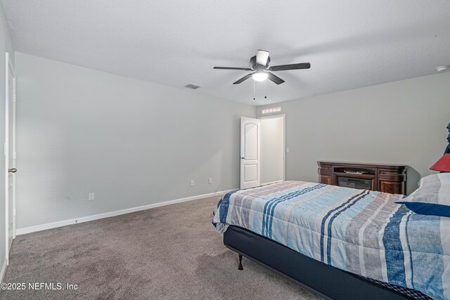 8552 Lake George Cir W, Macclenny, FL 32063 - carpeted bedroom with baseboards and a ceiling fan