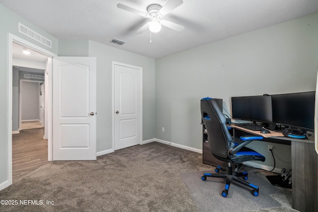 8552 Lake George Cir W, Macclenny, FL 32063 - carpeted home office with a ceiling fan and baseboards