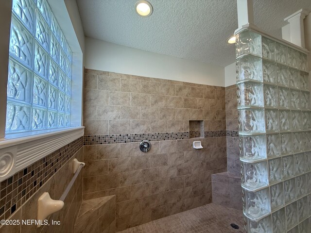 9205 Camshire Dr, Jacksonville, FL 32244 - bathroom featuring a textured ceiling and walk in shower