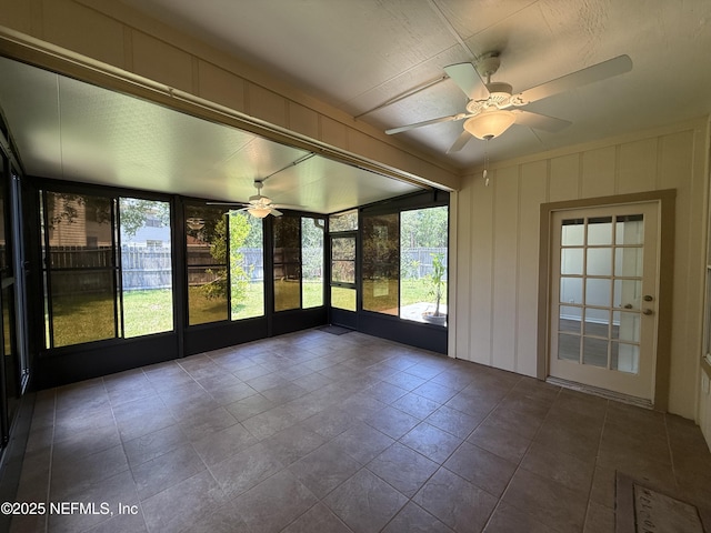9205 Camshire Dr, Jacksonville, FL 32244 - unfurnished sunroom with ceiling fan, a decorative wall, and tile patterned floors
